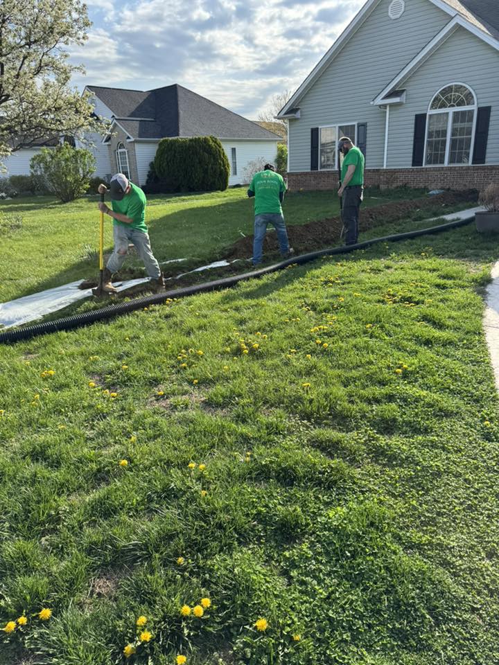 Four Roots Landscaping crew trenching a residential yard in Front Royal VA